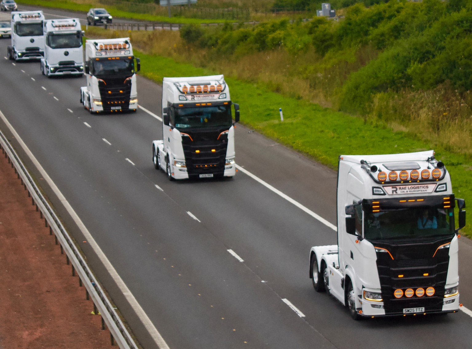 Rae Logistics fleet travelling on a motorway